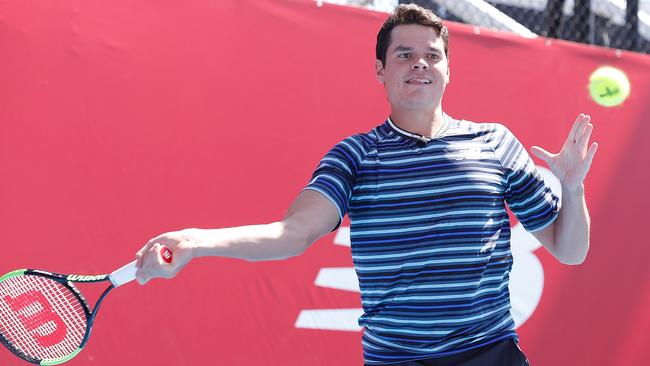 Milos Raonic (right) with Australian cricket captain Steve Smith at Melbourne Park on Thursday.