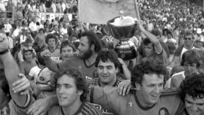 The giant Campbell Dews, middle with beard just to the left of the BRL premiership trophy. (Pic Jim Fenwick)