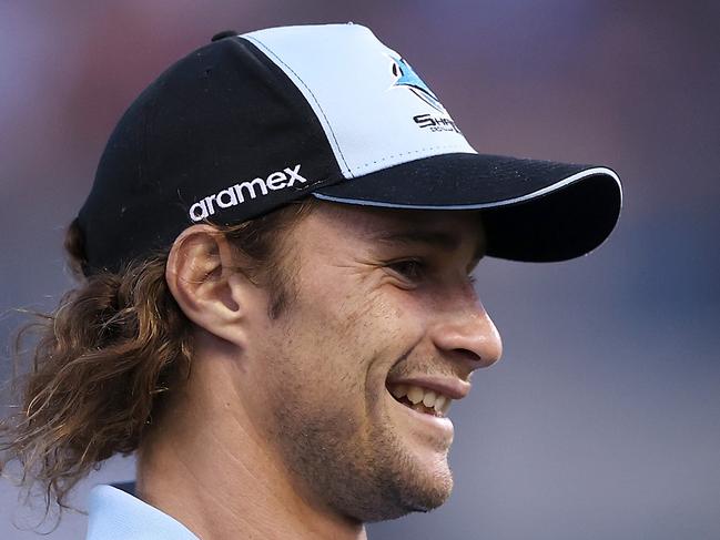 PENRITH, AUSTRALIA - MARCH 04: Injured Sharks player Nicho Hynes watches on during the warm-up before during the round one NRL match between Cronulla Sharks and South Sydney Rabbitohs at BlueBet Stadium on March 04, 2023 in Cronulla, Australia. (Photo by Mark Kolbe/Getty Images)