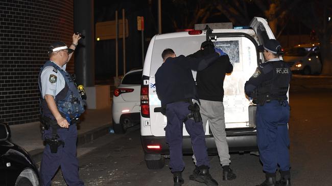 Police arrest an 18-year-old near the scene. Picture: Gordon McComiskie