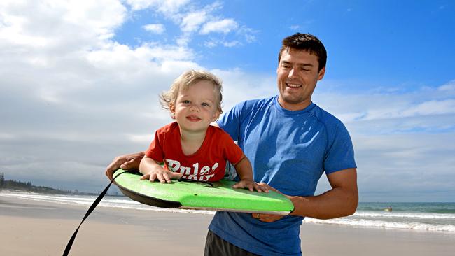 18-month-old Charlie Creagh and his dad Luke on holiday from Western Australia enjoying Mooloolaba Beach.