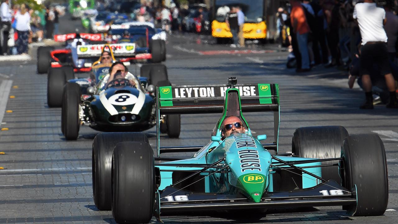 Adelaide-era F1 cars drive along Wakefield Street through Victoria Square in the city as part of the old Adelaide Motorsport Festival. Picture: Tom Huntley.