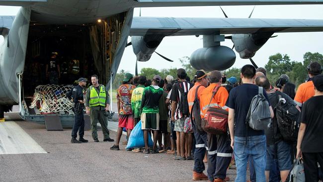 Evacuees preparing to board an ADF aircraft.