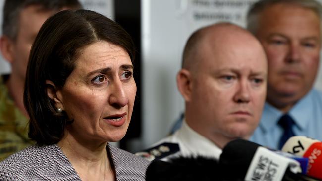 NSW Premier Gladys Berejiklian (left) and RFS Commissioner Shane Fitzsimmons (right) are seen during a press conference at the Rural Fire Service HQ in Sydney on Monday.