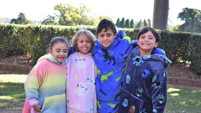 Brissy kids braving Toowoomba wind - Billie, Vienna, Kaio, and Samsen at Grammar Downlands Day, Saturday, August 19, 2023. Picture: Peta McEachern