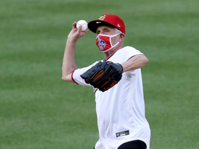 Dr Anthony Fauci, 79, threw out the ceremonial first pitch prior for the Washington Nationals … but did he get it off the mound? Picture: AFP