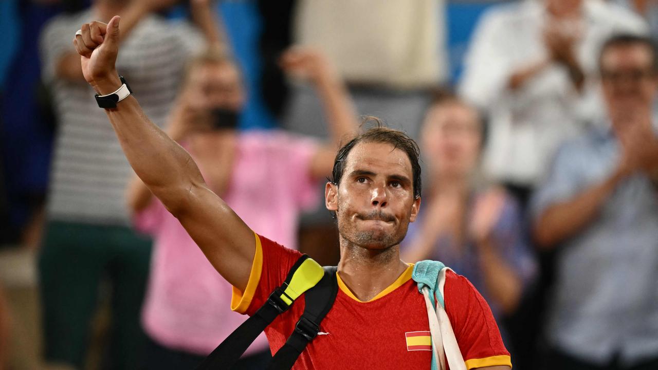 Spain's Rafael Nadal waves goodbye after he and Spain's Carlos Alcaraz lose to US' Austin Krajicek and US' Rajeev Ram in their men's doubles quarter-final tennis match on Court Philippe-Chatrier at the Roland-Garros Stadium during the Paris 2024 Olympic Games, in Paris on July 31, 2024. (Photo by CARL DE SOUZA / AFP)