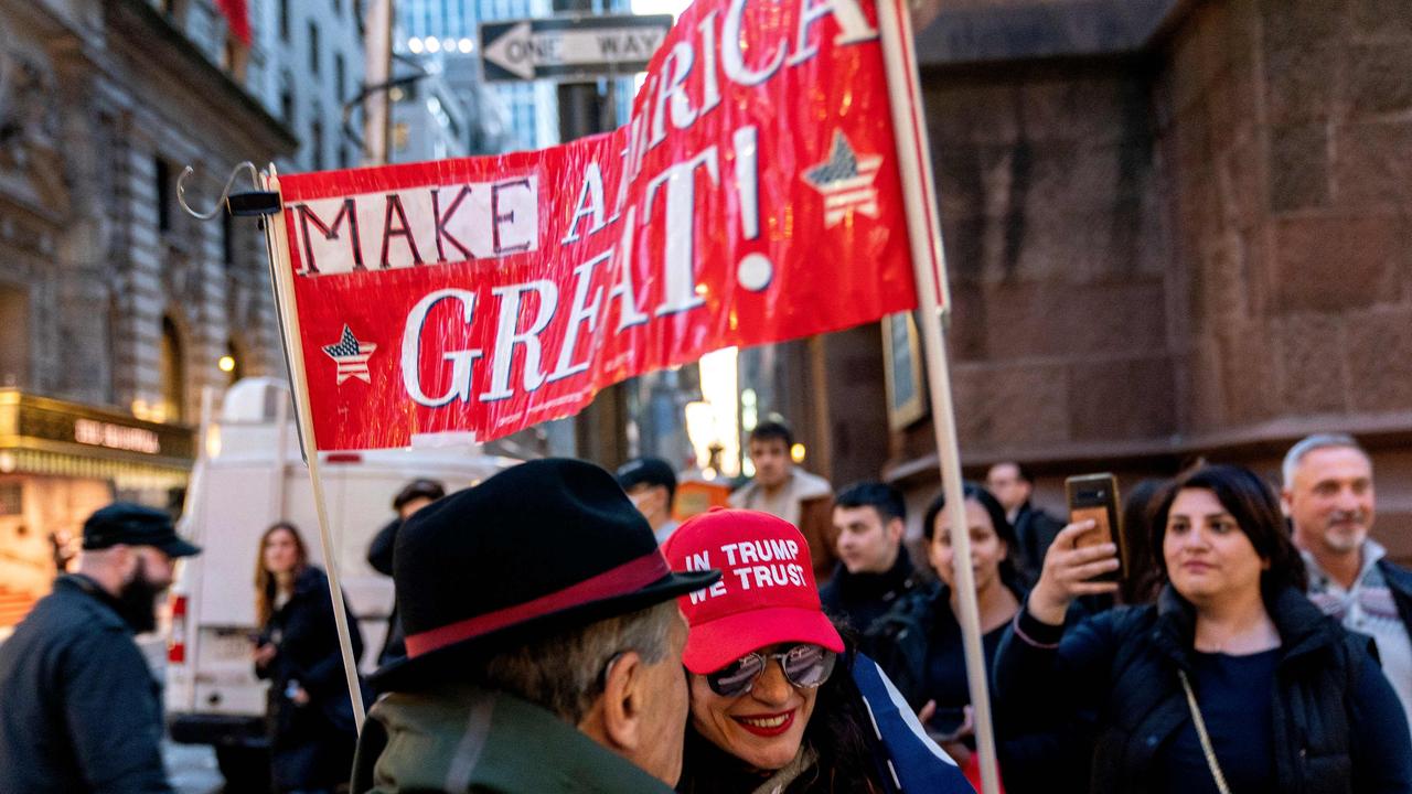 A number of Trump supporters stood outside Trump Tower in New York City awaiting the ex-President’s arrival. Picture: Stefani Reynolds/AFP