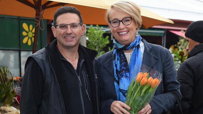 Lord Mayor Sally Capp (right) with flower stall trader Joe Leuzzi at Queen Victoria Market. Picture: Josie Hayden