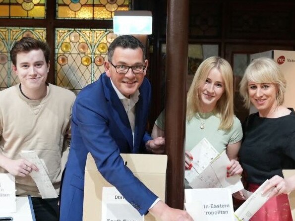 Daniel Andrews with Cath, and their two eldest children Noah and Grace, voting at a polling booth near parliament on Thursday night.