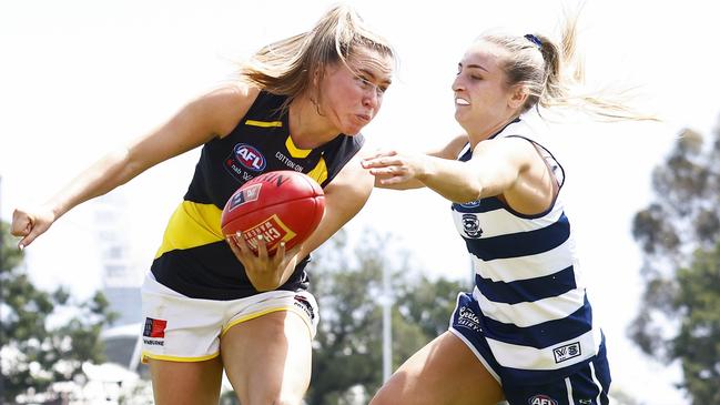 Sarah Dargan handballs under pressure during a AFLW practice match between Richmond and Geelong last month.