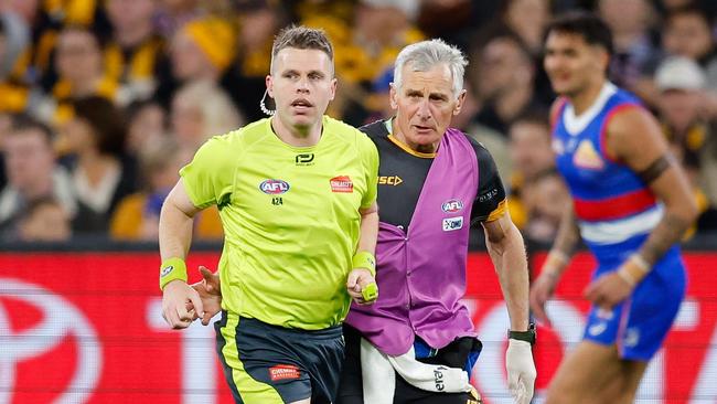 Nick Foot made it to his first grand final as a field umpire after he was accidentally cleaned up by Western Bulldogs forward Aaron Naughton in the qualifying final. Picture: Dylan Burns / Getty Images