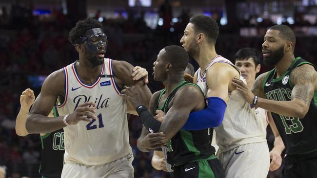 Joel Embiid (left) and Ben Simmons, of the Philadelphia 76ers, engage in a bit of push and shove with the Boston Celtics’ Jayson Tatum (middle) and Marcus Morris (right). Photo: Getty Images