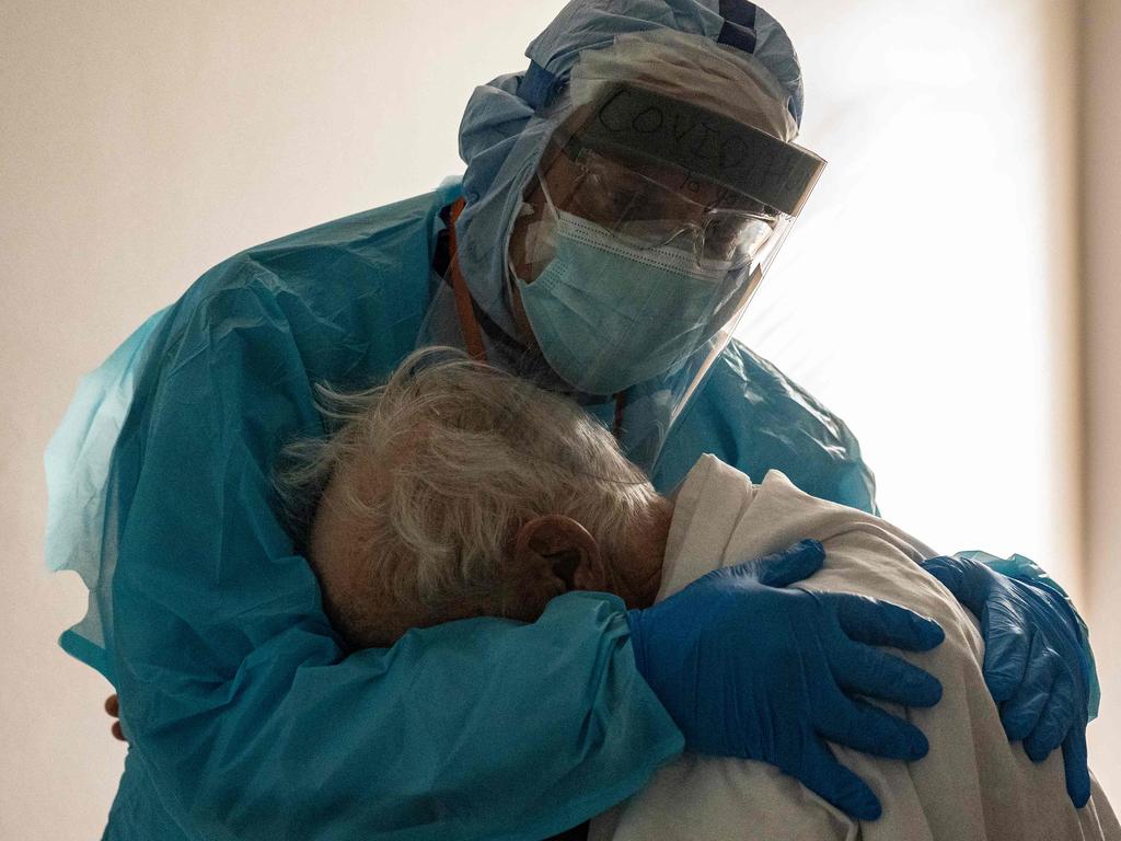 Dr Joseph Varon hugs and comforts a patient in the COVID-19 intensive care unit during Thanksgiving last month at the United Memorial Medical Center in Houston, Texas. Picture: Go Nakamura/Getty/AFP