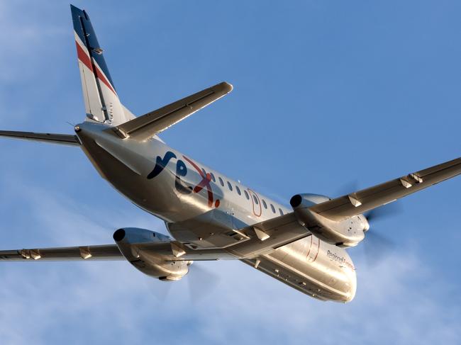 Adelaide, Australia - REX (Regional Express Airlines) Saab 340 twin engined regional commuter aircraft taking off from Adelaide Airport.Escape 15 October 2023Doc HolidayPhoto - iStock