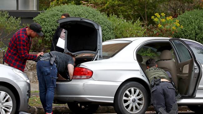 Police were seen searching a car on the street. Picture: Toby Zerna