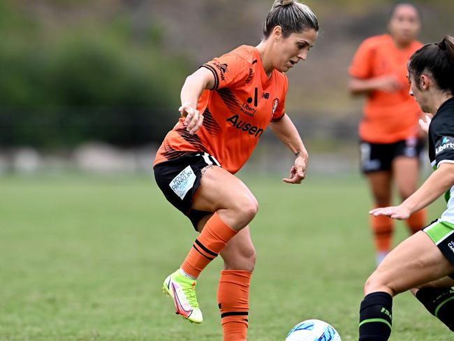 BRISBANE, AUSTRALIA - MARCH 10: Katrina Gorry of the Roar takes on the defence of Emma Ilijoski of Canberra during the A-League Women's match between Brisbane Roar and Canberra United at James Drysdale Reserve, on March 10, 2022, in Brisbane, Australia. (Photo by Bradley Kanaris/Getty Images)