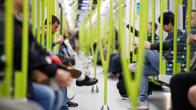 SYDNEY, AUSTRALIA - NewsWire Photos. August 19 2024. Commuters ride a metro train on the opening day of the Sydney Metro. Picture: NewsWire / Max Mason-Hubers