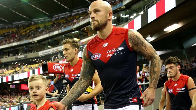 Jack Viney and Nathan Jones lead the Demons out for their Round 1 clash. Picture: Mark Dadswell