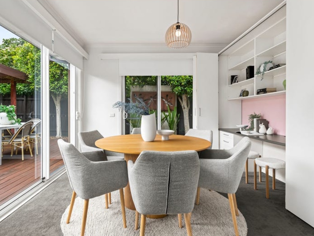 The dining room opens out to the backyard.