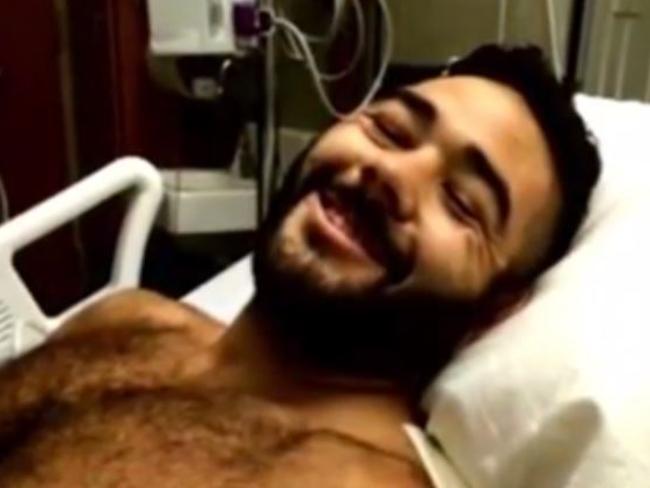 Smiling already ... Chris Mintz grins from his hospital bed, despite having been shot seven times. Picture: ABC7