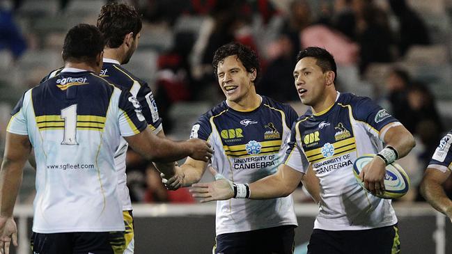 CANBERRA, AUSTRALIA - JULY 11: Brumbies players celebrate a try by Matt Toomua during the round 19 Super Rugby match between the Brumbies and the Force at Canberra Stadium on July 11, 2014 in Canberra, Australia. (Photo by Stefan Postles/Getty Images)