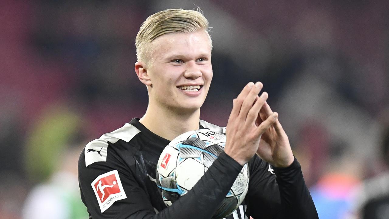 A match ball to cherish forever: Erling Braut Haaland after his debut hat-trick.