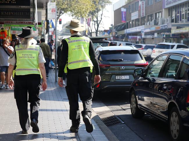 Parking rangers on John St in Cabramatta, which netted Fairfield Council more than $1m in parking fines in the 2017-18 financial year. Picture; Sam Ruttyn