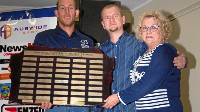 BEST AND FAIREST: Gary Stehbens Medal winner Jed Farraway from Miriam Vale. He is with Hayden and Roslyn Stehbens who are the relatives of the late Gary after whom the medal is named. Picture: Neil Redfern