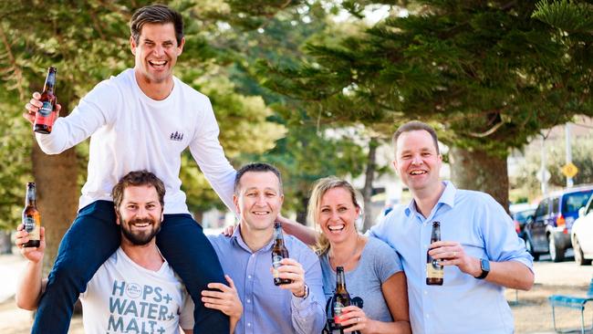 Adam Mitchell, Jaron Mitchell (on Adam’s shoulders), Peter Filipovic, Sheree Mitchell and Jan Craps from AB InBev. Picture: supplied.