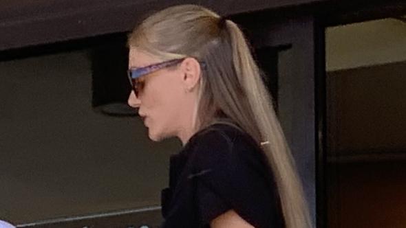 Kimberley Maree Tooz (black dress) pleaded guilty to eight counts of stealing by clerks or servants in her role as a gaming attendant at the Northern Beaches Bowls Club.