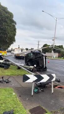 Car crushed after hitting traffic light pole