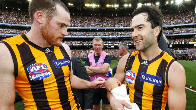 Jordan Lewis with best mate Jarryd Roughead and baby Freddie after the 2015 premiership win. Picture: Michael Klein