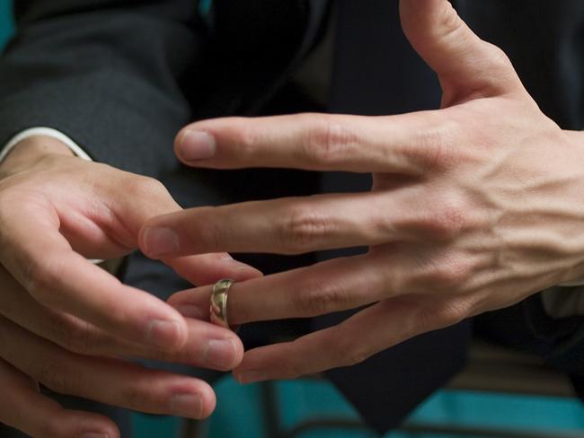 Man takes off wedding ring Picture: iStock