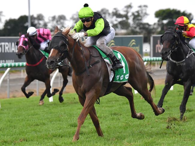 Jockey Jag Guthmann-Chester (centre) rides Cabeirian to victory in race four, the Lilydale Chicken Handicap during the QTIS Jewel Raceday at Aquis Park on the Gold Coast, Saturday, March 16, 2019, (AAP Image/Darren England.