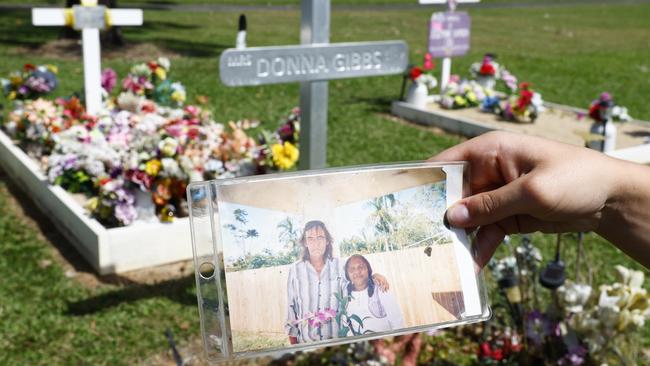 A photo of Tony Gibbs and his late wife Donna Gibbs in front of Mrs Gibbs’ gravesite. Picture: Brendan Radke