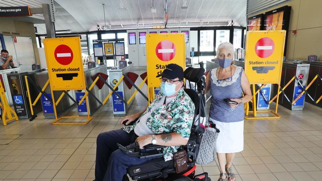 Mark and Doris Wood at Lidcombe train station after NSW trains called a snap strike leaving commuters stranded. Picture: John Feder