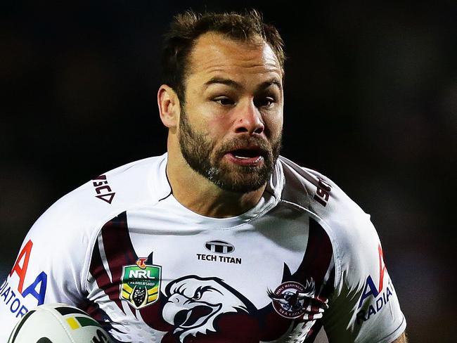 Manly's Brett Stewart makes a break to set up a try by Manly's Peta Hiku during the Manly v Wests Tigers rugby league game at Brookvale Oval, Sydney. Pic Brett Costello