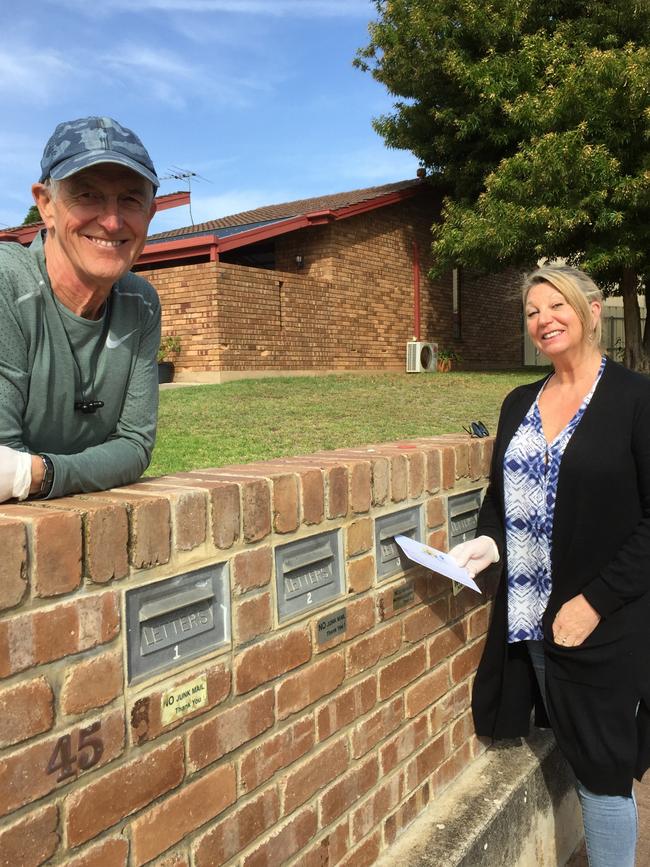 David Cruikshanks-Boyd and Karen Braithwaite, of Seacliff, are delivering calling cards as part of the 5049 Kind Neighbour project. Picture: Supplied