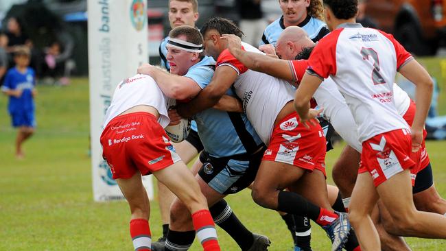 Woolgoolga forward Jake Elphick held in a tackle. Picture: Leigh Jensen