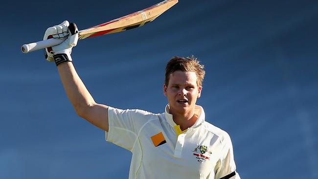 Steve Smith celebrates his first century on Australian soil in 2013.