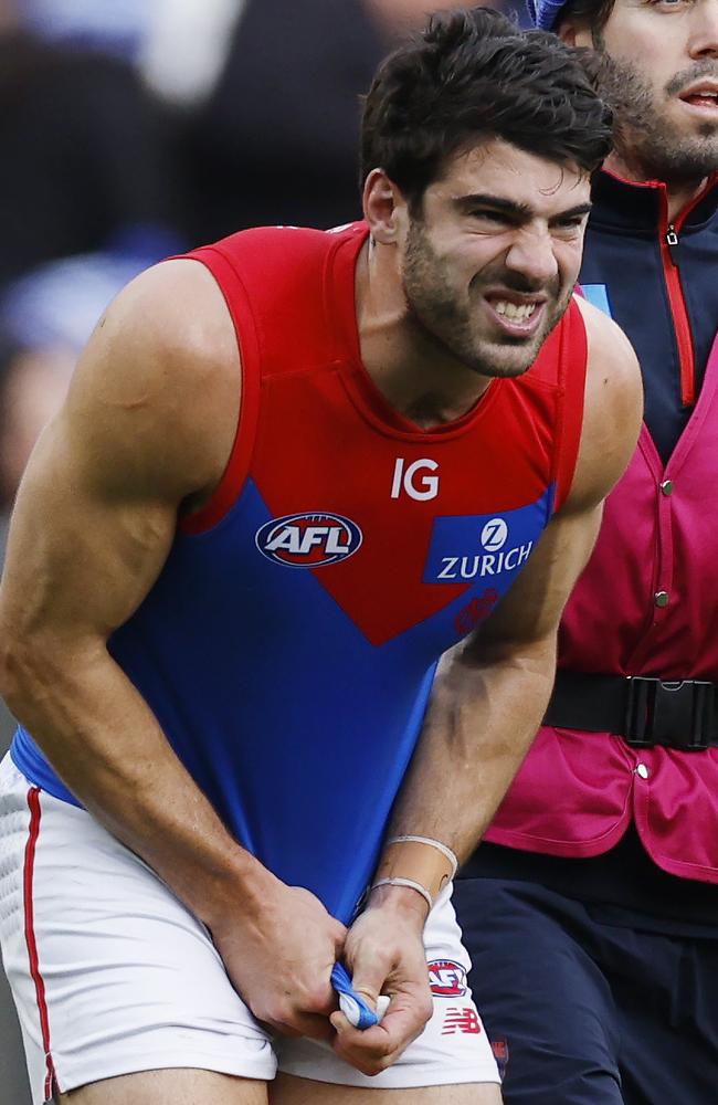 Christian Petracca of the Demons in pain after copping a knee in the ribs. Picture: Michael Klein