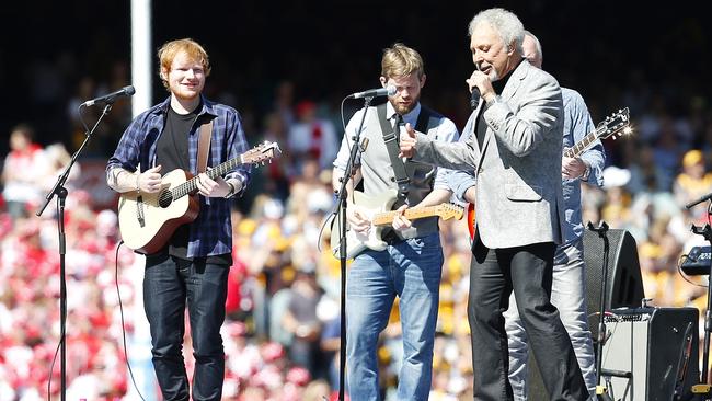 Legend ... Ed Sheeran rocks out with Tom Jones at the 2014 AFL Grand Final. Picture: David Caird.