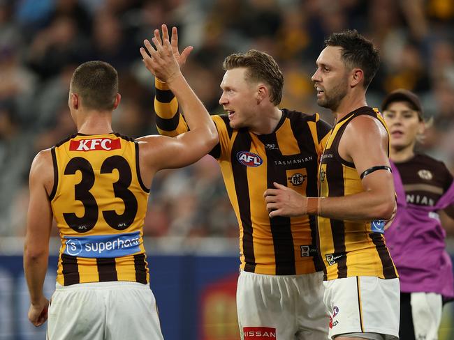 MELBOURNE, AUSTRALIA - MARCH 20: James Sicily of the Hawks (C) celebrates kicking a goal during the round two AFL match between Carlton Blues and Hawthorn Hawks at Melbourne Cricket Ground on March 20, 2025, in Melbourne, Australia. (Photo by Robert Cianflone/Getty Images)