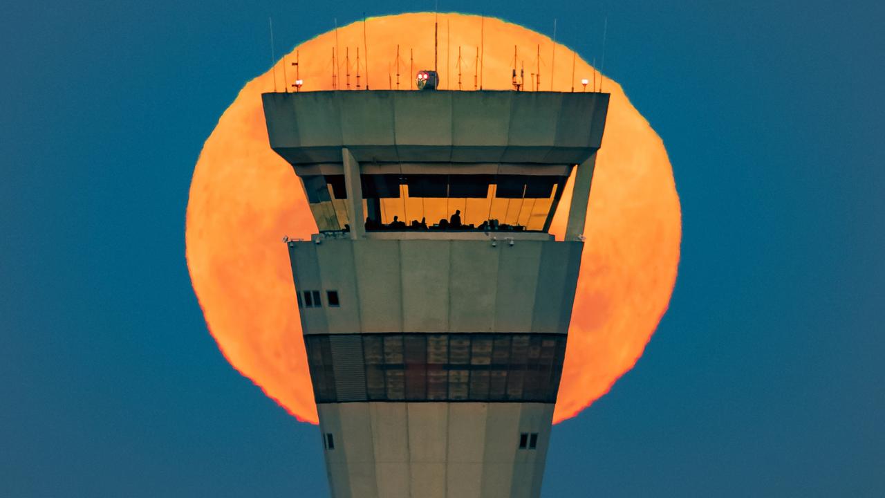 Air traffic controllers at work in the Brisbane Airport tower. Picture: Michael Marston