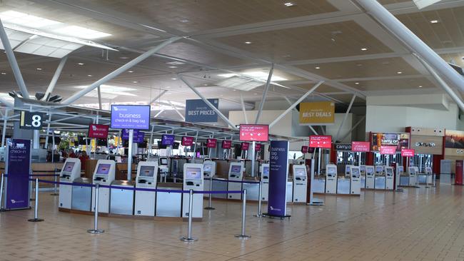 An uncharacteristically quiet scene at the Brisbane International Airport departure lounge. AAP Image/Richard Gosling