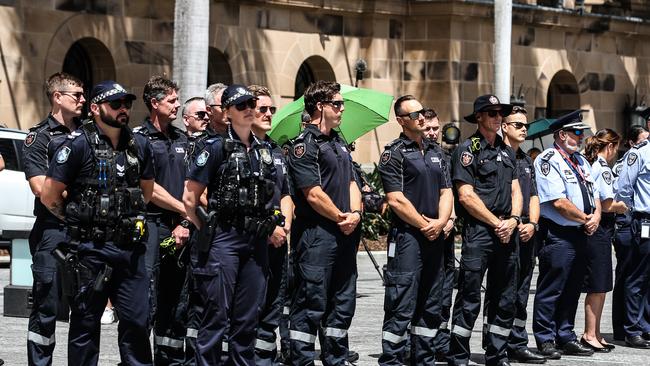 Members of the Queensland police service and other emergency services watch the Queensland Police Memorial Service for Constable Rachel McCrow and Constable Matthew Arnold from King George Square. Picture: Zak Simmonds