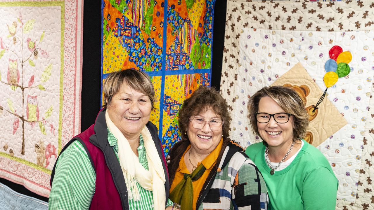 Looking at Toowoomba Quilters Club work are (from left) Raelene Antonio, Gloria Jones and Rachael Martial at Craft Alive at the Goods Shed, Sunday, May 22, 2022. Picture: Kevin Farmer