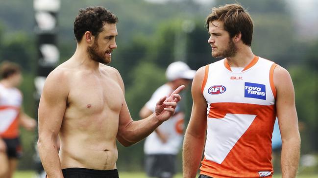 Shane Mumford gives Matthew Flynn some ruck pointers. Picture: Justin Lloyd