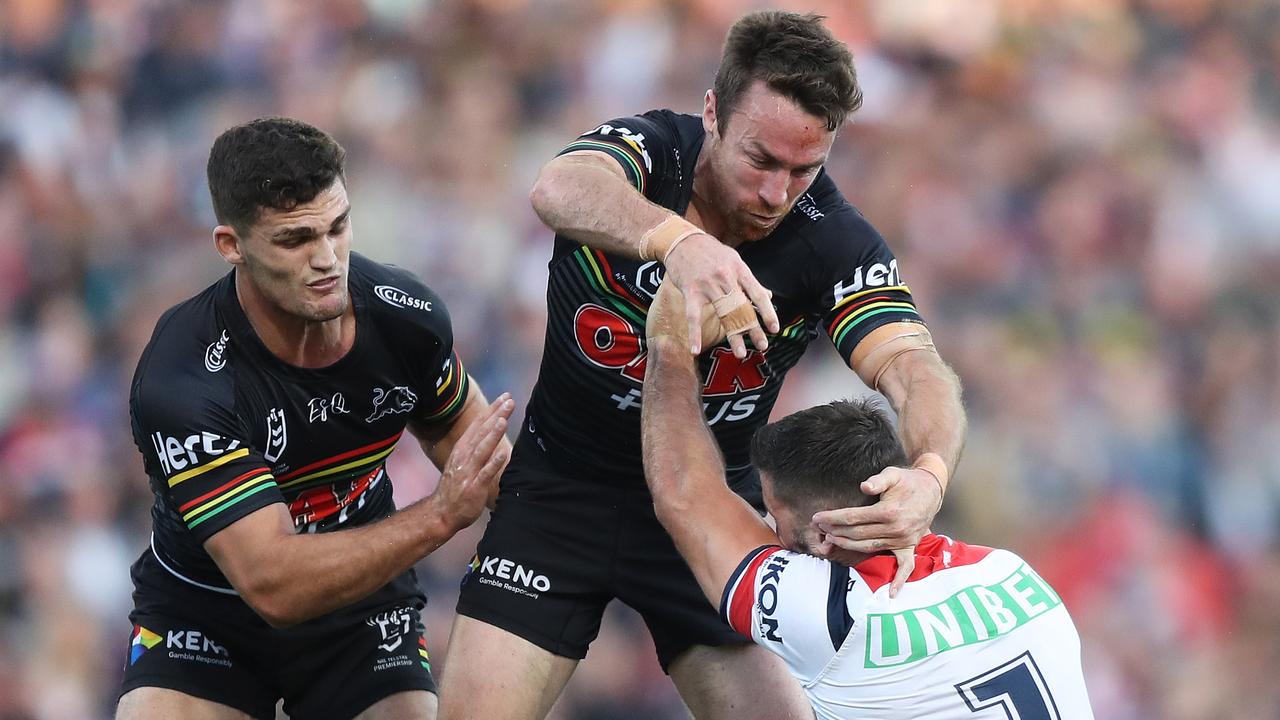 James Maloney puts a bit hit on James Tedesco in a solid performance for the Panthers on Sunday afternoon.